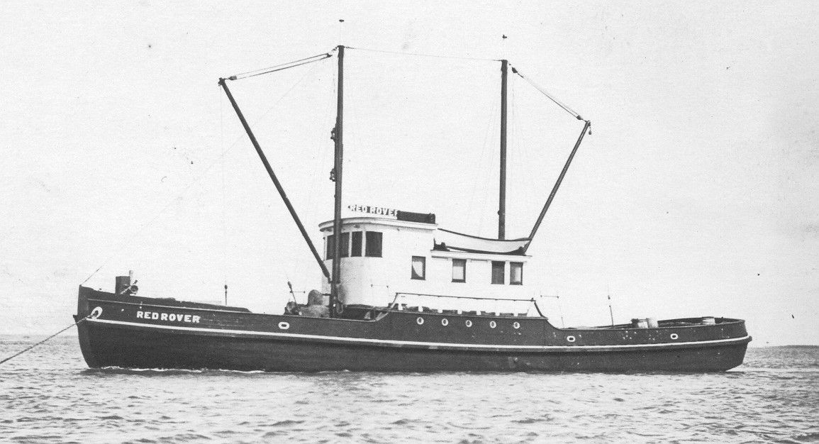 A black and white photo of a boat in the ocean