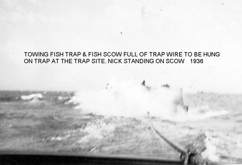 A black and white photo of a boat towing a fish trap