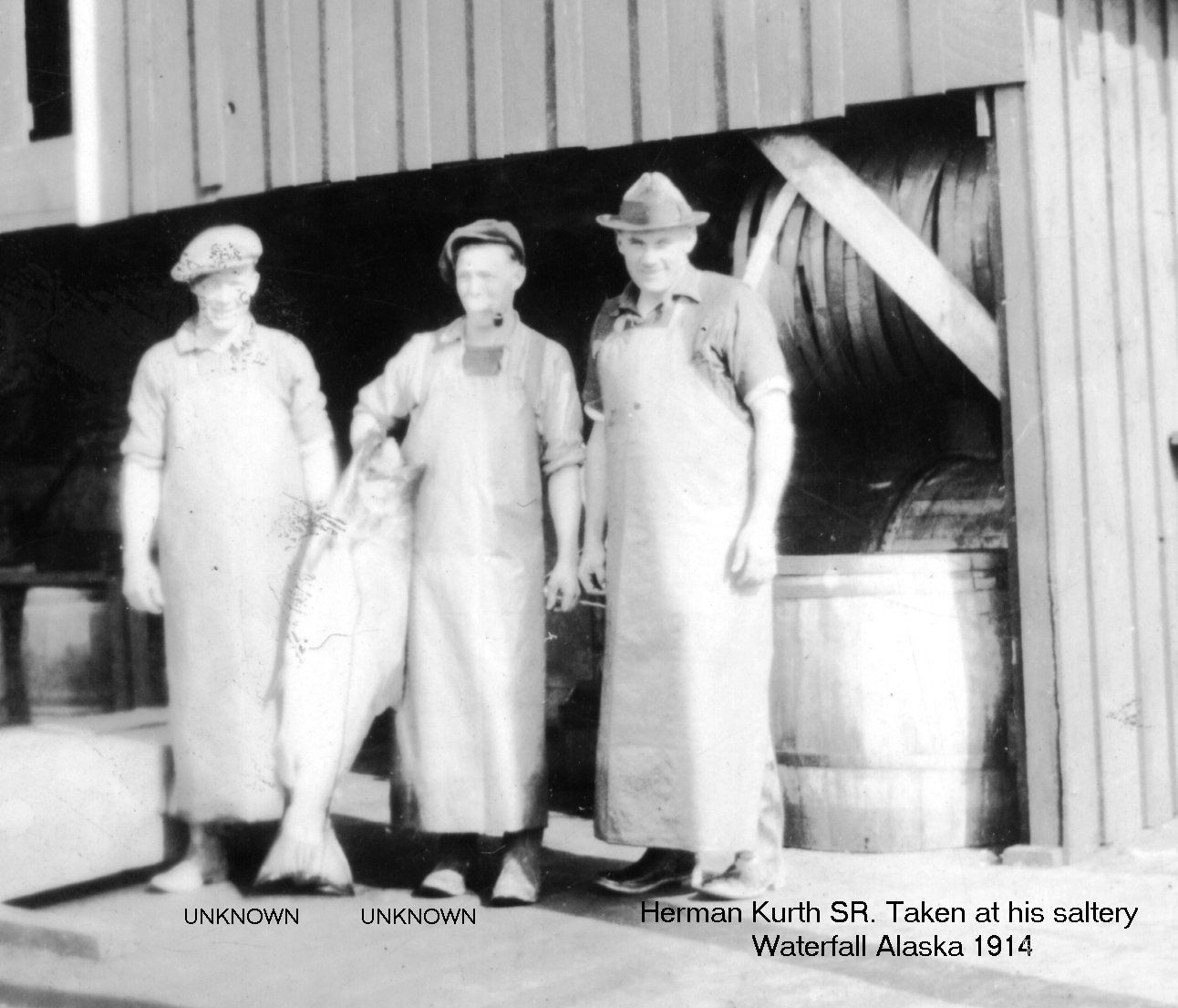 A black and white photo of three men standing next to each other