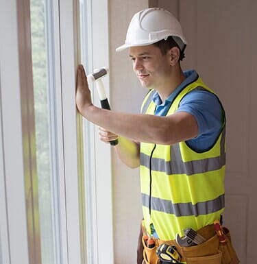 Siding Installations — Construction Worker Installing New Windows in South Park, PA