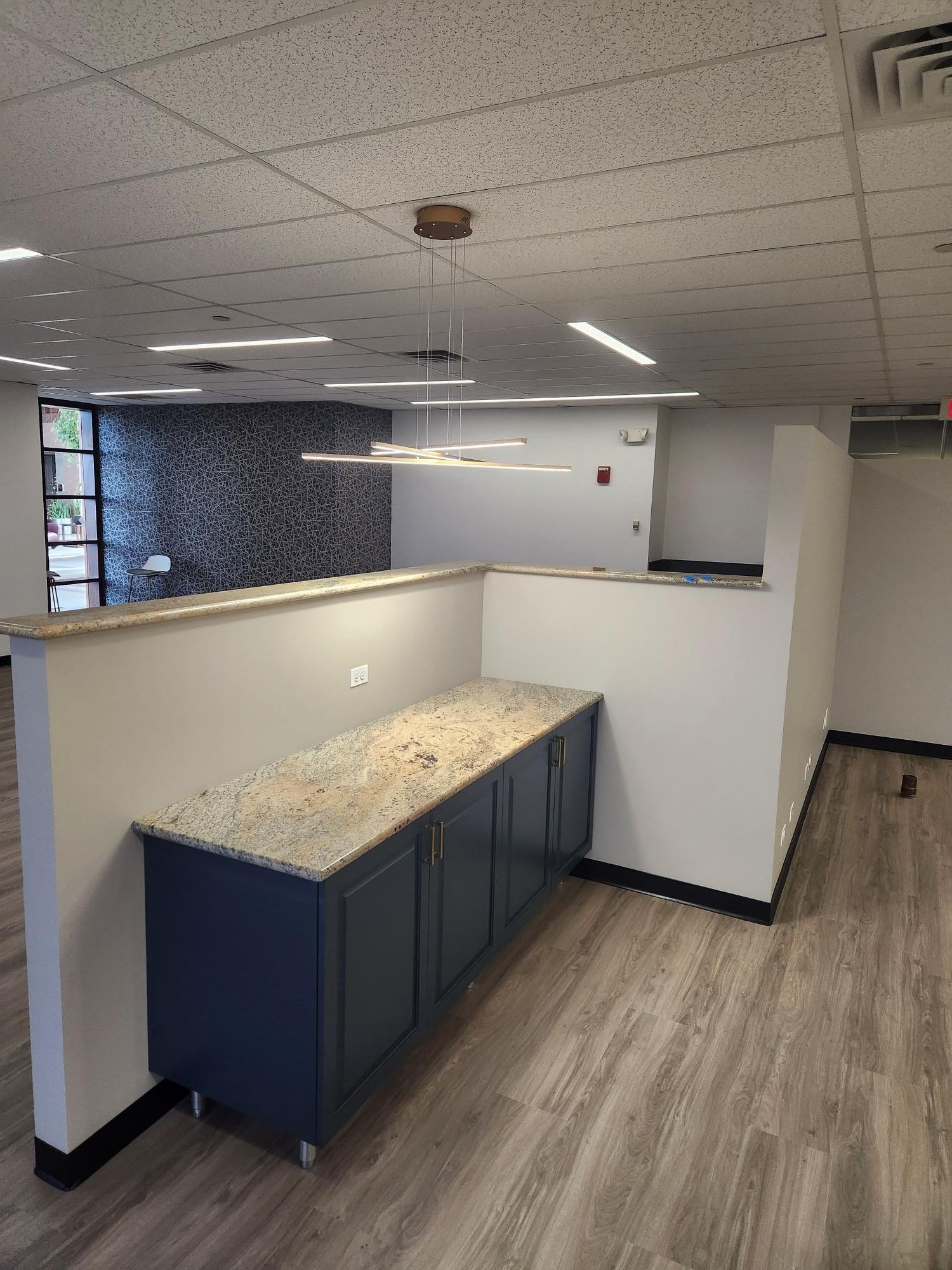 There is a counter in the middle of the room.