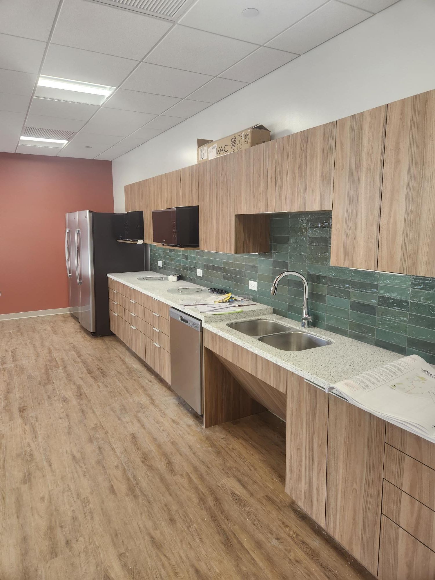 A kitchen with wooden cabinets and stainless steel appliances.