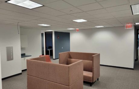 There are two chairs in the middle of the room.