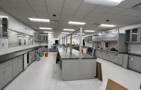 A large room with a lot of cabinets and counters