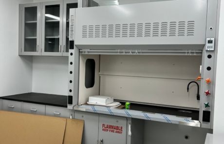 A chemical hood with a flammable sign on it