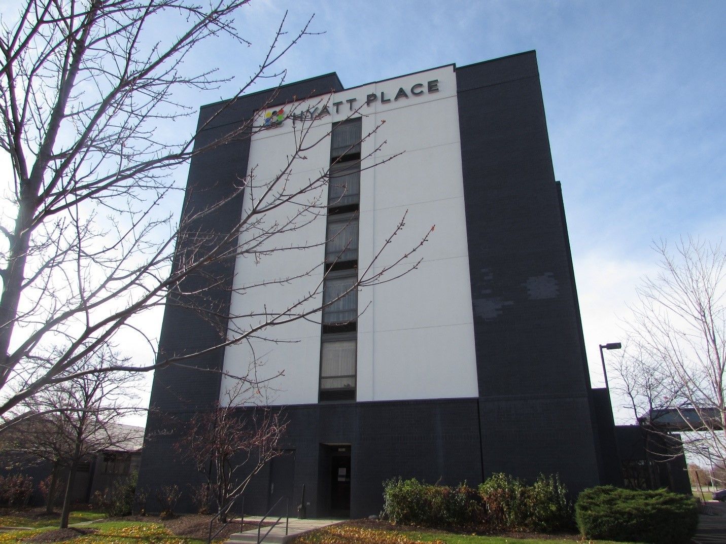 A tall building with the word place on it