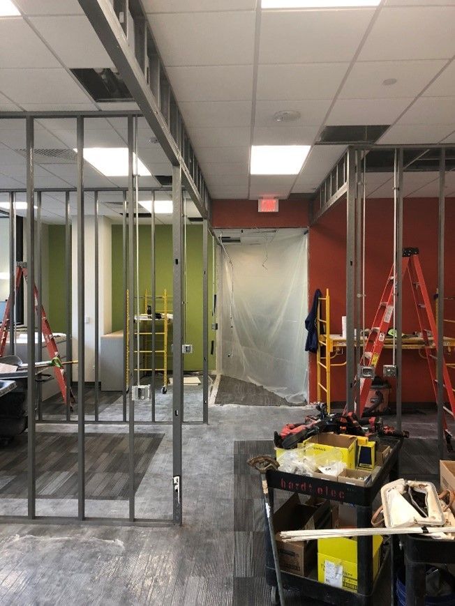 A room that is being remodeled with a ladder on the floor - Elgin, IL - Omni Commercial Group, Inc