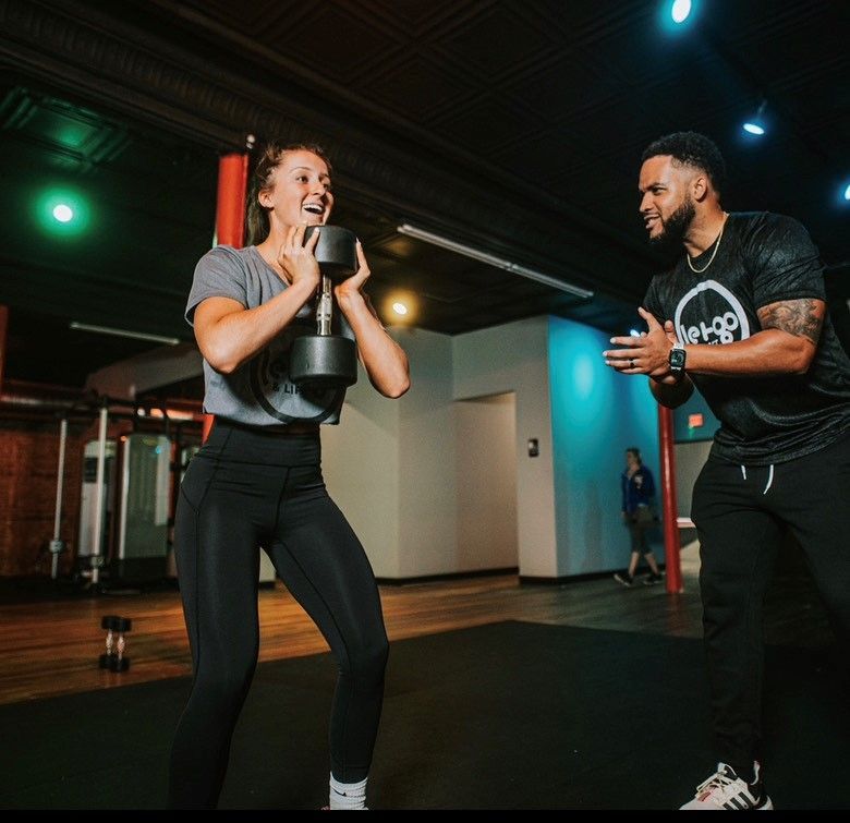 Trainer Showing Workout Plans — Evansville, IN — Let Go & Lift