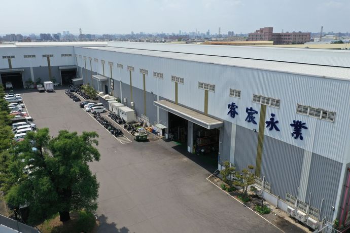 An aerial view of a large building with chinese writing on it