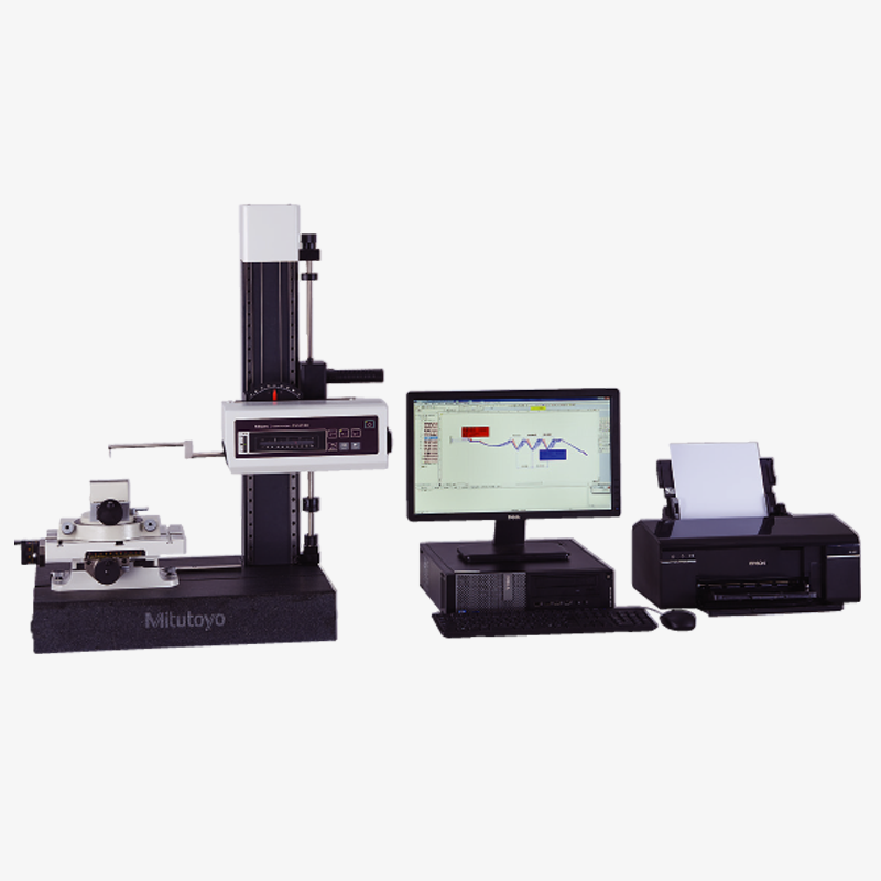 A machine is sitting next to a computer and printer.