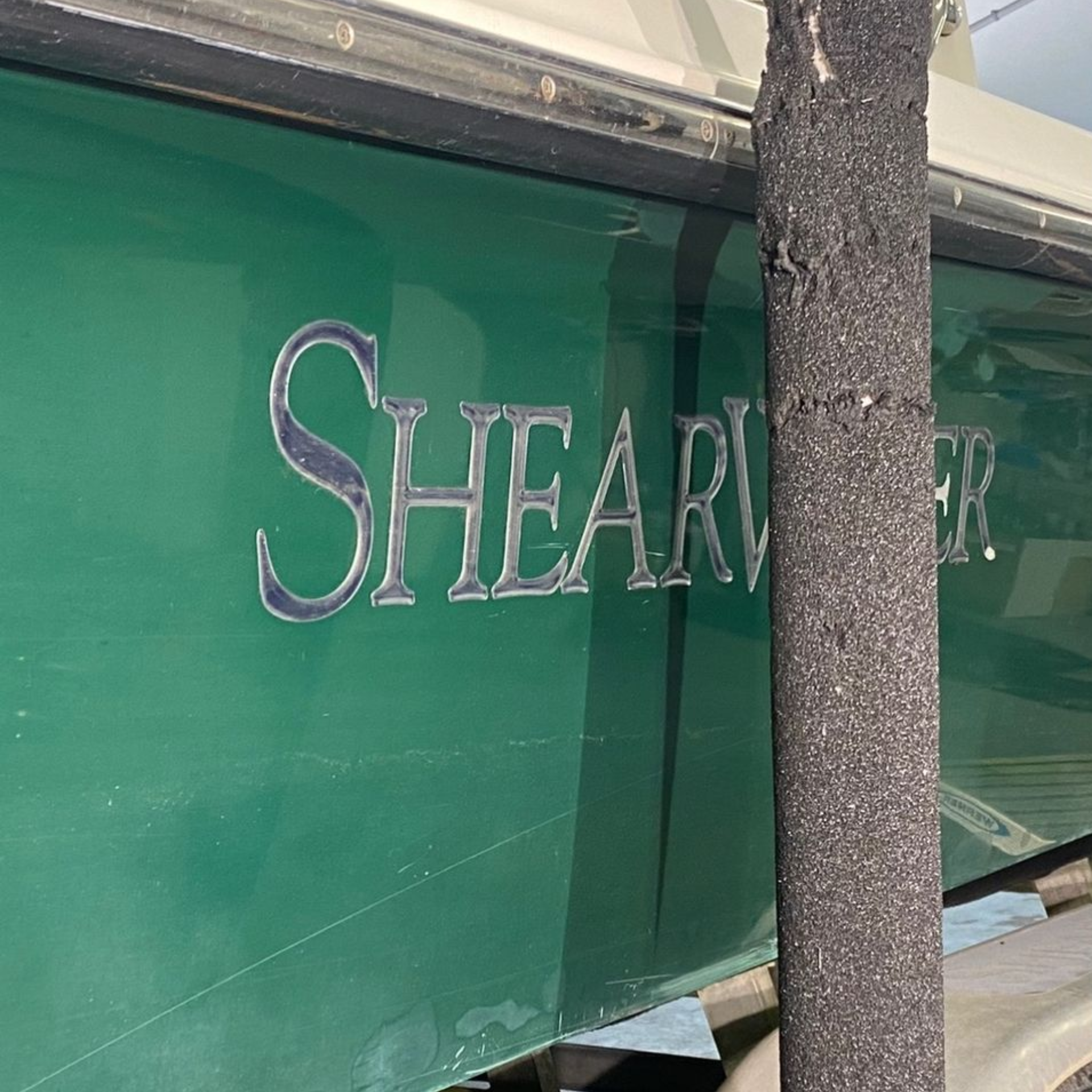 Green boat hull with silver 