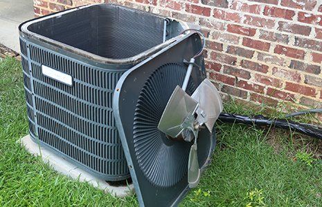 AC Repair — Fan Off Top of AC Condenser During Maintenance in Concord, NC