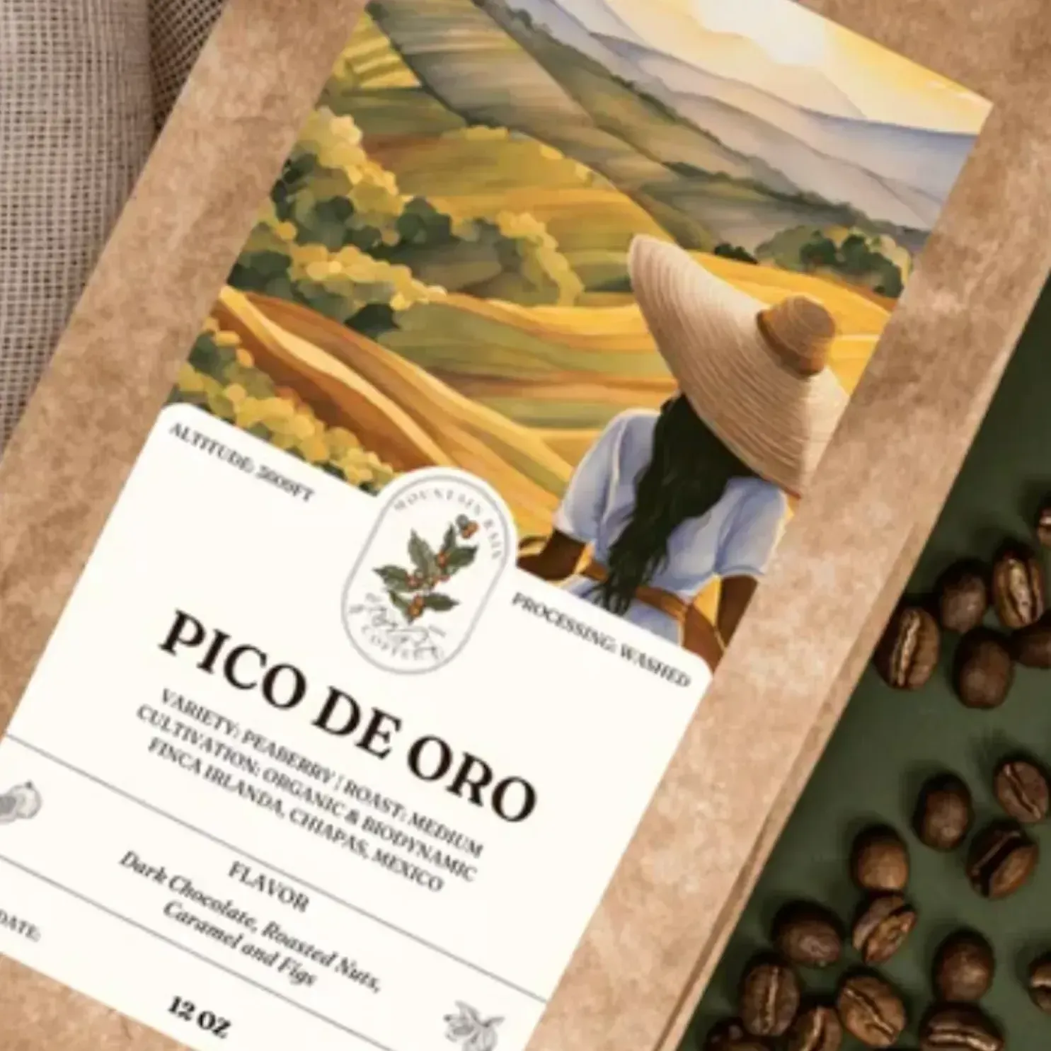 A bag of pico de oro coffee beans sits on a table