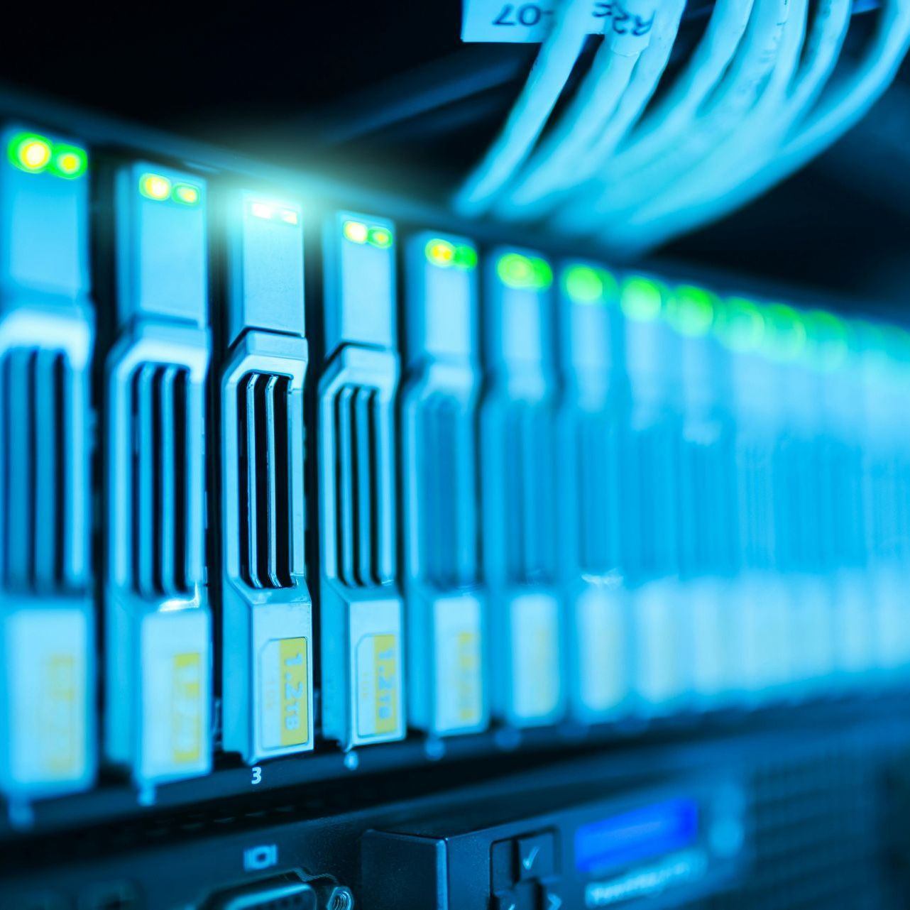 A bunch of servers are connected to each other in a server room