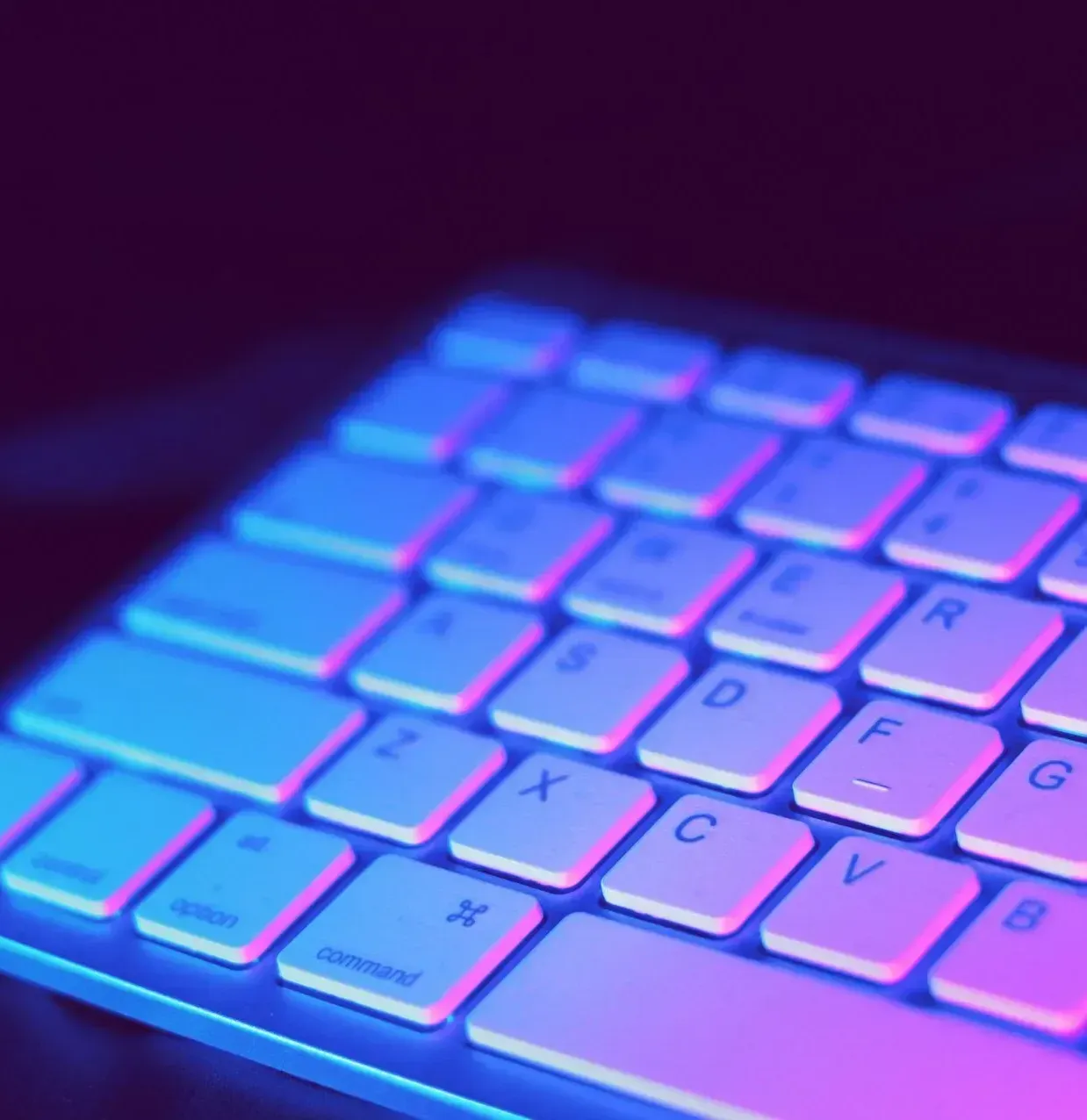 A close up of a keyboard with blue and purple keys
