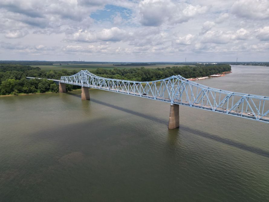 An aerial view of a bridge over a large body of water.