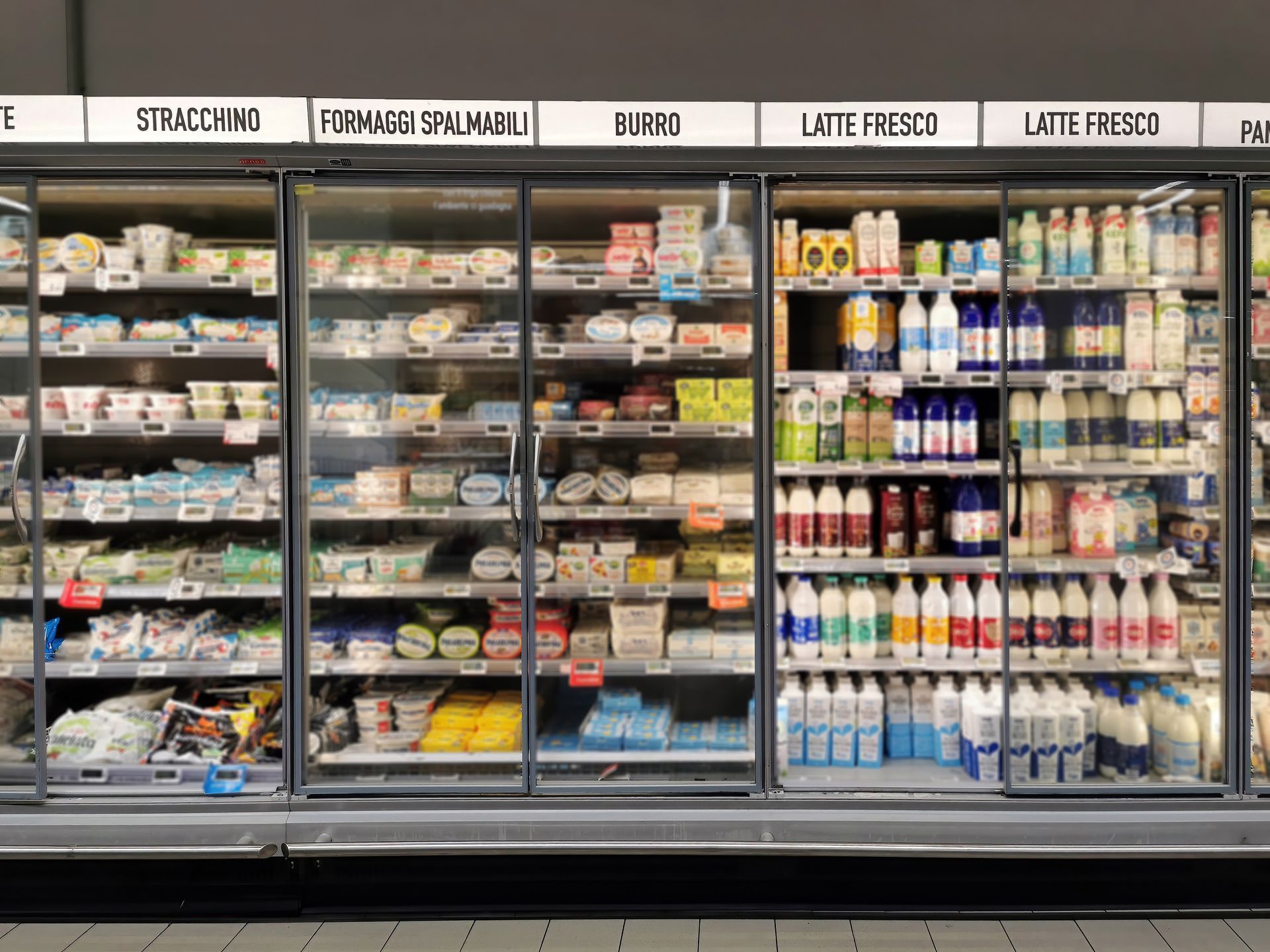 Refrigerators with fresh foods in a supermarket.