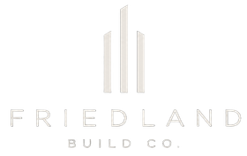 Friedland Build Co. logo with minimalist white skyscraper icon on a light background