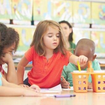 Toddlers coloring in daycare - Hilltop Nursery Schools in Toms River, NJ