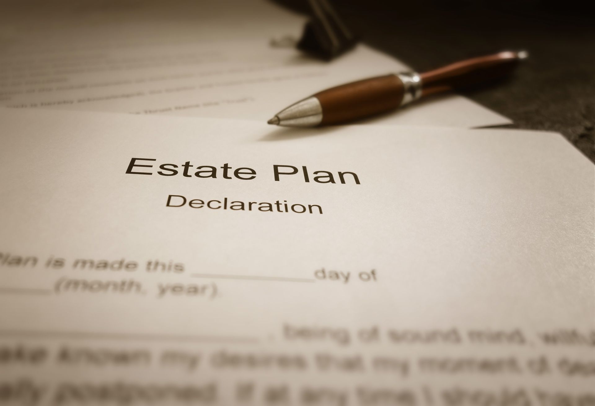 A pen rests on top of an estate plan declaration