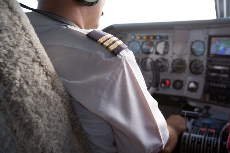 a pilot is sitting in the cockpit of an aeroplane