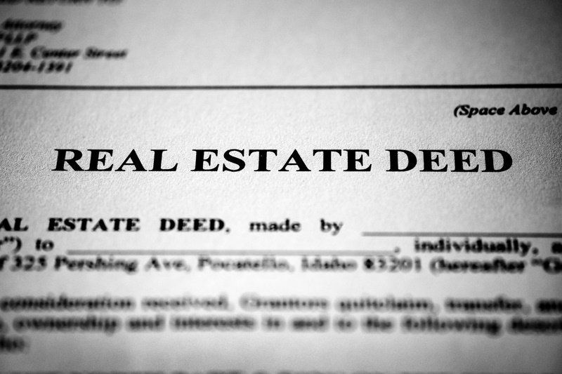 a close up of a real estate deed