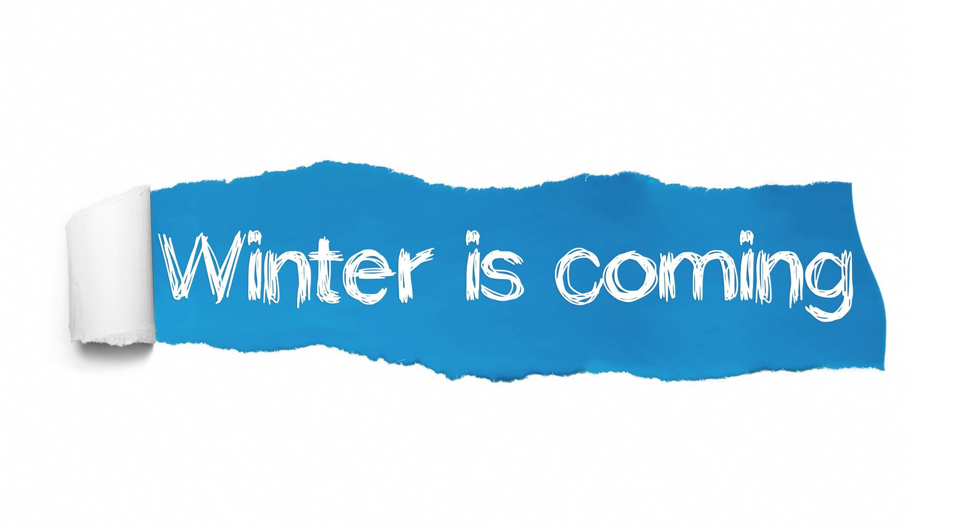 A piece of torn paper with the words winter is coming written on it