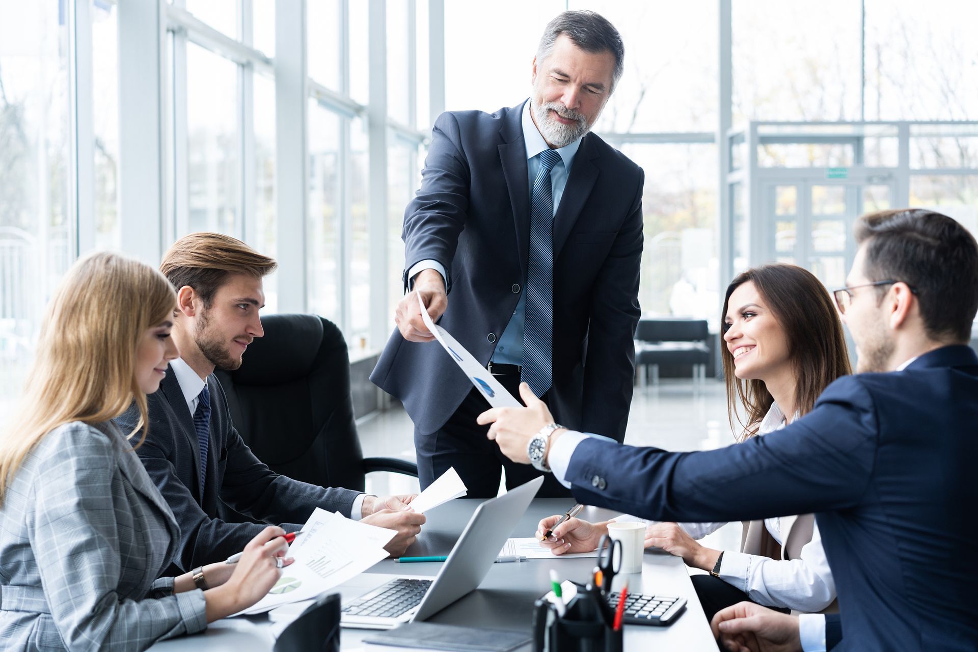 A group of business people are having a meeting in an office.