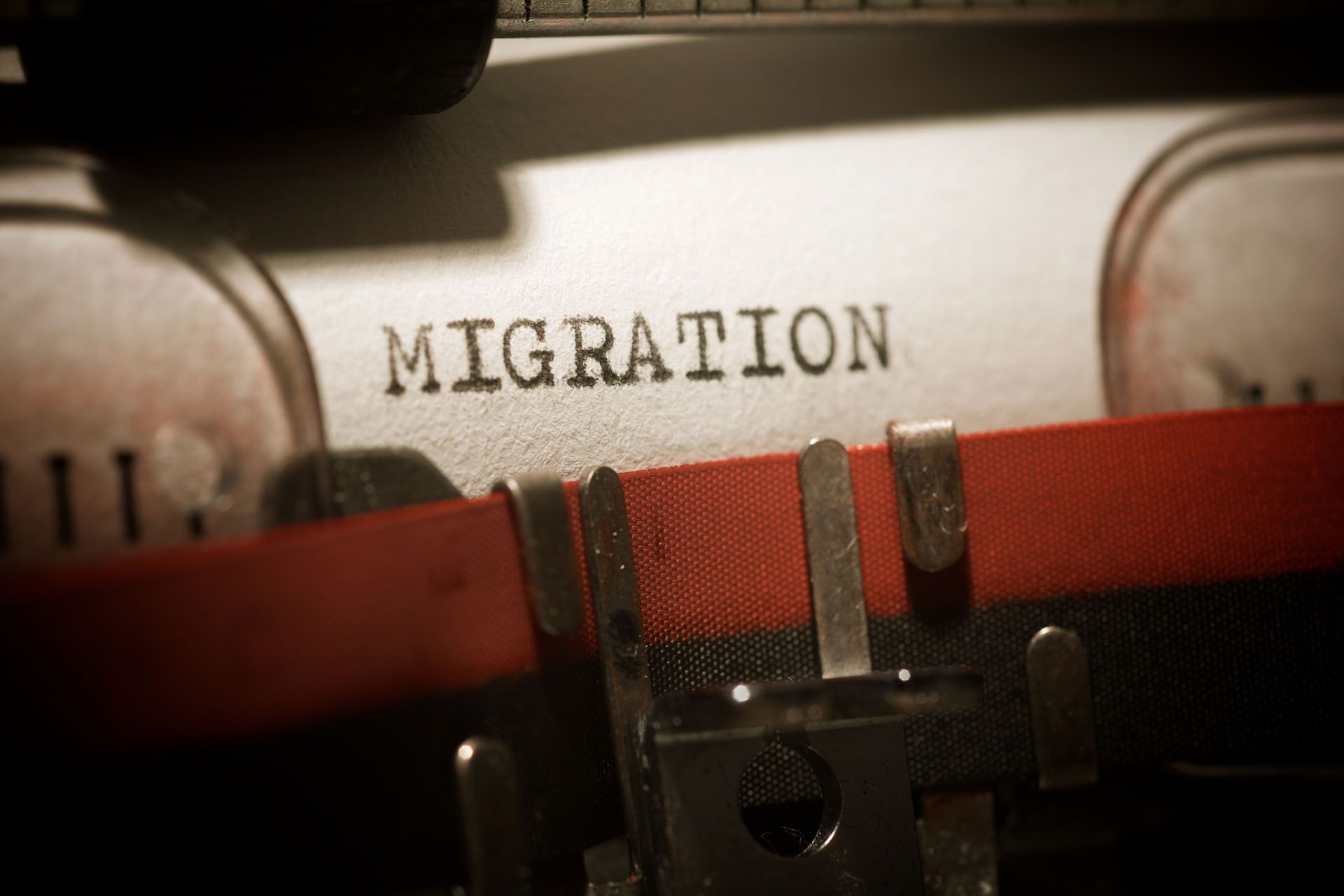 the word migration written by a typewriter