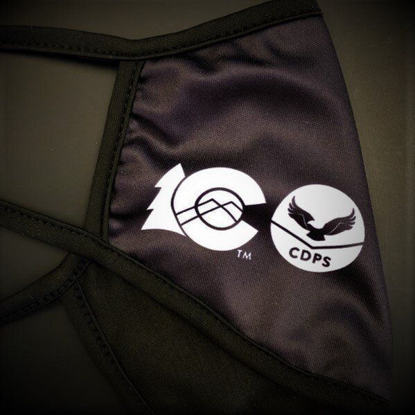 A black face mask with the cdps logo on it