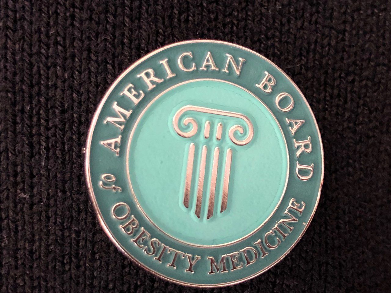 A coin that says american board of obesity medicine