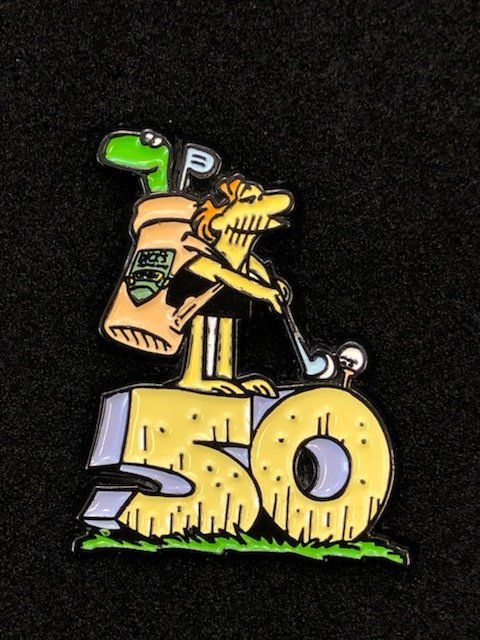 A 50th anniversary pin with a cartoon character holding a golf club