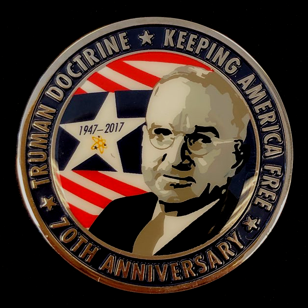 A coin that says truman doctrine keeping america free