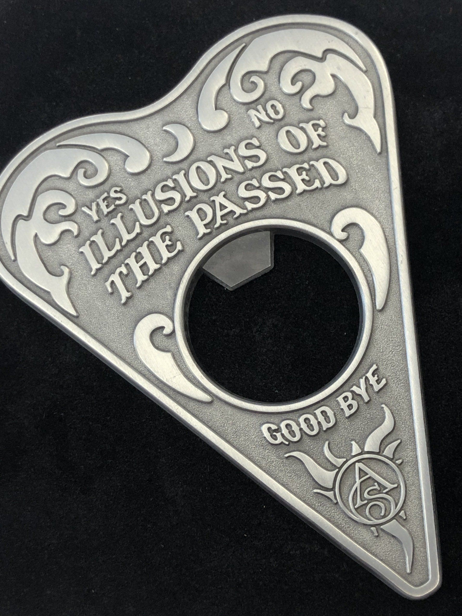 A bottle opener that says yes illusions of the passed