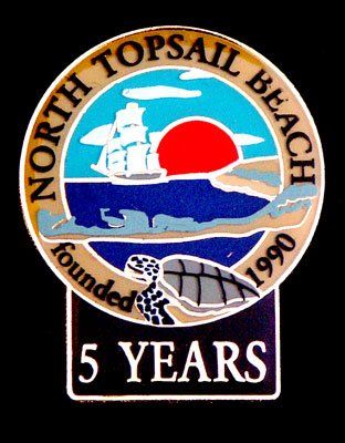A logo for north topsail beach that was founded in 1990