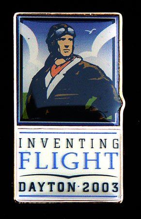 A pin that says inventing flight dayton 2003