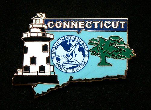 A connecticut pin with a lighthouse and a tree