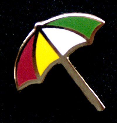 A pin of a colorful umbrella on a black background