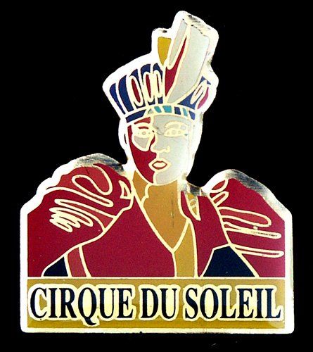 A cirque du soleil pin with a man wearing a crown