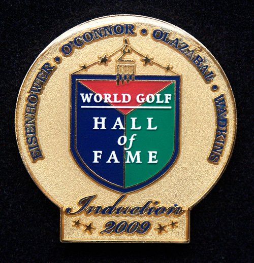 A gold coin that says world golf hall of fame