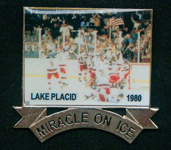 A pin that says miracle on ice on it