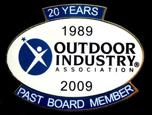 A pin that says 20 years 1989 outdoor industry association 2009 past board member