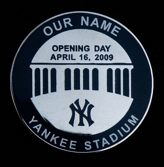A coin that says our name yankee stadium on it