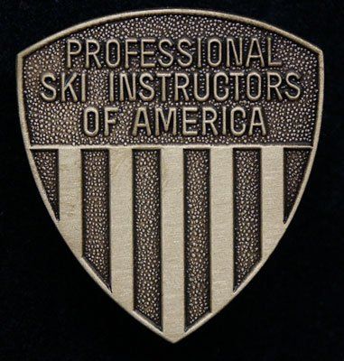 A badge that says professional ski instructors of america