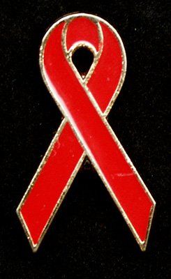 A red ribbon with a hole in the middle on a black background