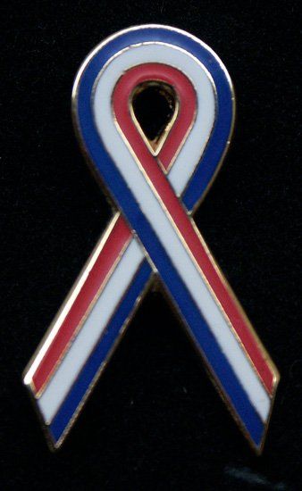 A red white and blue ribbon on a black background