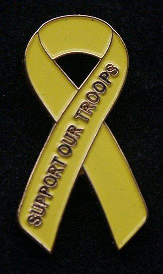 A yellow ribbon that says support our troops on it