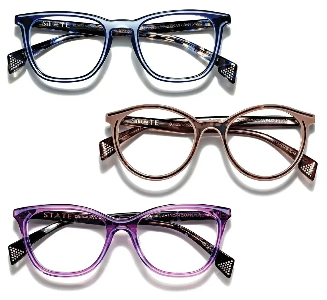 Three pairs of glasses are lined up on a white background