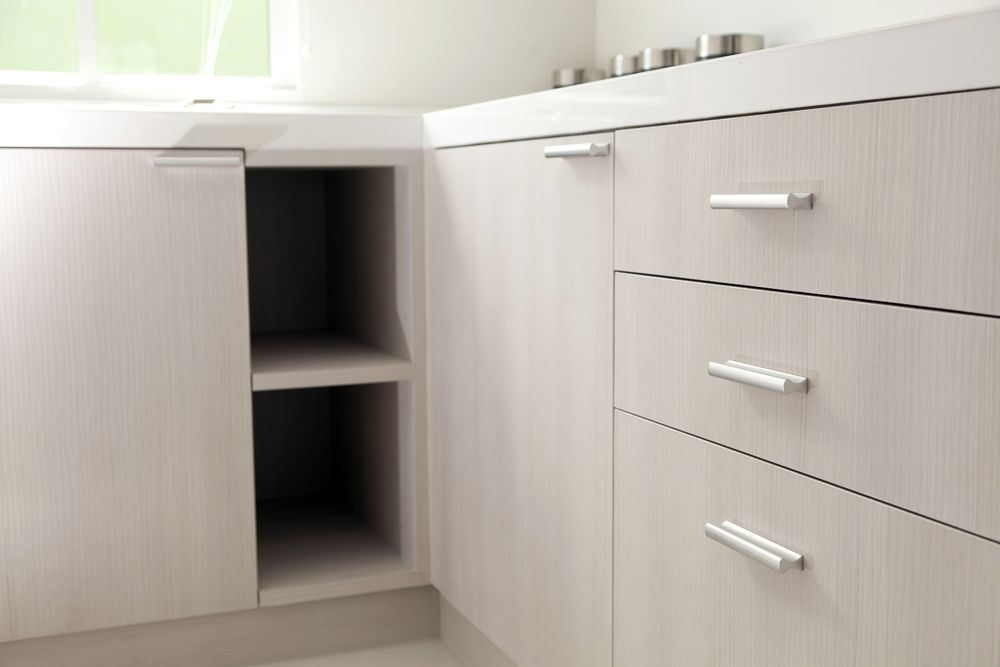 Corner Kitchen Cabinets With Open Shelf, Drawers, and Light Wood Grain Finish — Maken Kitchens & Cabinets in Tweed Heads, NSW