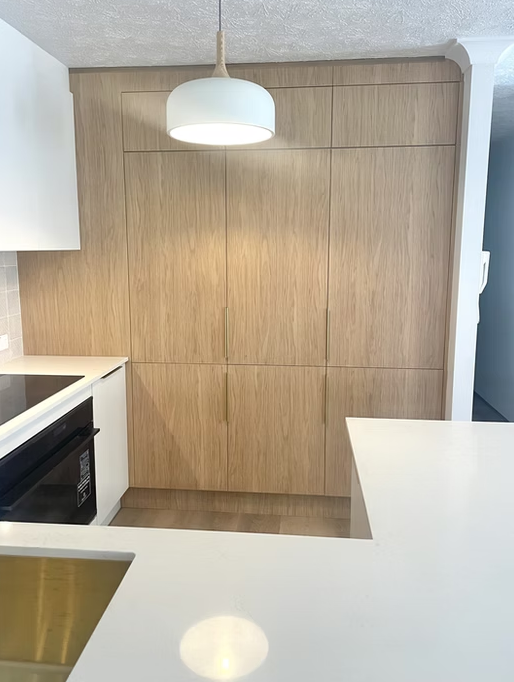 Wooden Built-in Shelving Unit With a Glass-doored Cabinet — Maken Kitchens & Cabinets in Chinderah, NSW